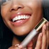 Luxevéria Lip Care Essence Oil in a slim glass bottle